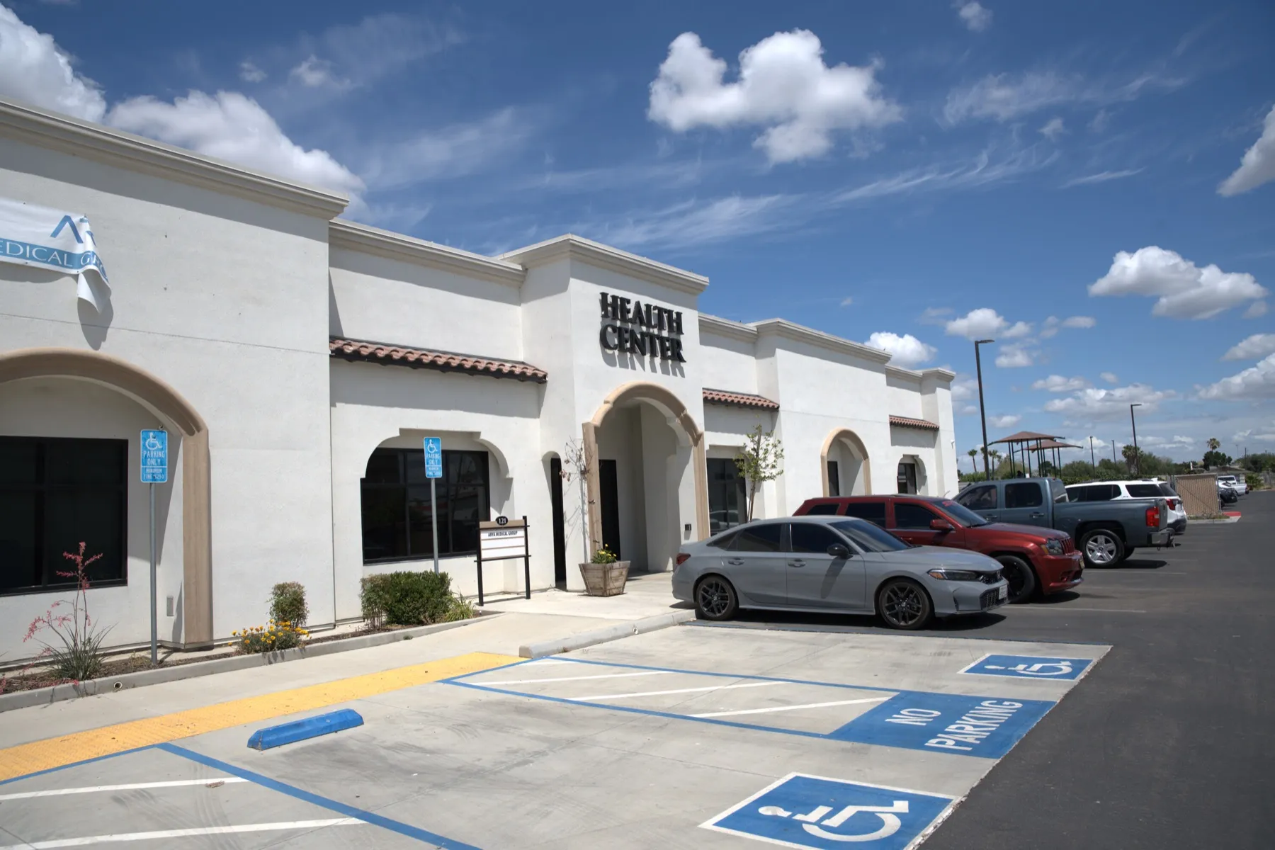 The Arya Medical Group clinic building and parking lot in Mendota, CA
